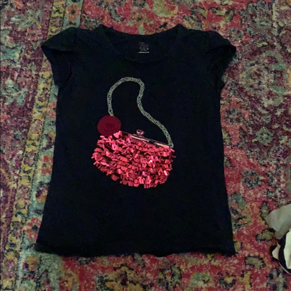 A cute tee shirt with a purse sequin design